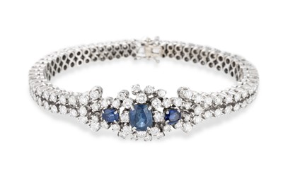 Lot 175 - A SAPPHIRE AND DIAMOND BRACELET, the central...
