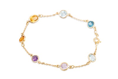 Lot 119 - A MULTI GEM SET BRACELET, the gems collet set...