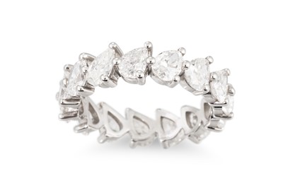 Lot 120 - A DIAMOND ETERNITY RING, set with 14 pear...