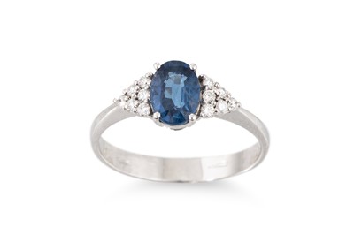 Lot 243 - A SAPPHIRE AND DIAMOND RING, the oval sapphire...