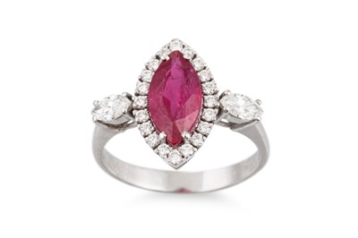 Lot 247 - A MARQUISE RUBY AND DIAMOND CLUSTER RING, to...