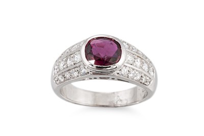 Lot 267 - A RUBY AND DIAMOND RING, the oval ruby to...