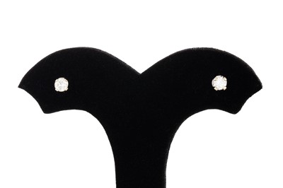 Lot 19 - A PAIR OF DIAMOND STUD EARRINGS, the round cut...