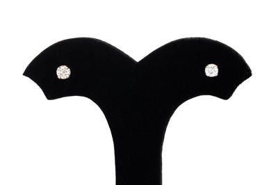 Lot 28 - A PAIR OF DIAMOND STUD EARRINGS, the round cut...