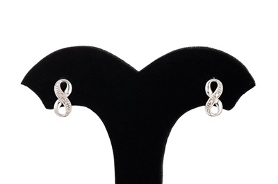 Lot 32 - A PAIR OF DIAMOND SET STUD EARRINGS, modelled...