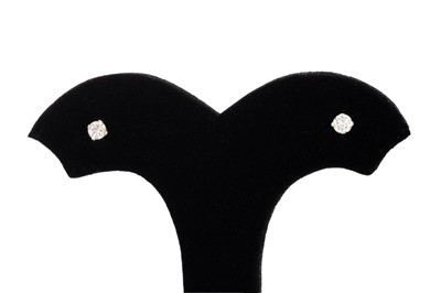 Lot 77 - A PAIR OF DIAMOND STUD EARRINGS, the round cut...