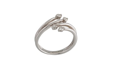 Lot 55 - A DIAMOND RING, of cross over design, mounted...