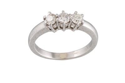 Lot 164 - A DIAMOND THREE STONE RING, mounted in 18ct...