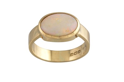 Lot 135 - AN OPAL RING, the cabochon stone mounted in...