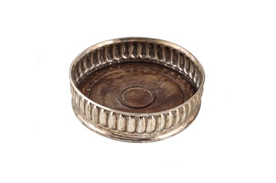 Lot 531 - A MODERN CIRCULAR SILVER WINE COASTER, London...