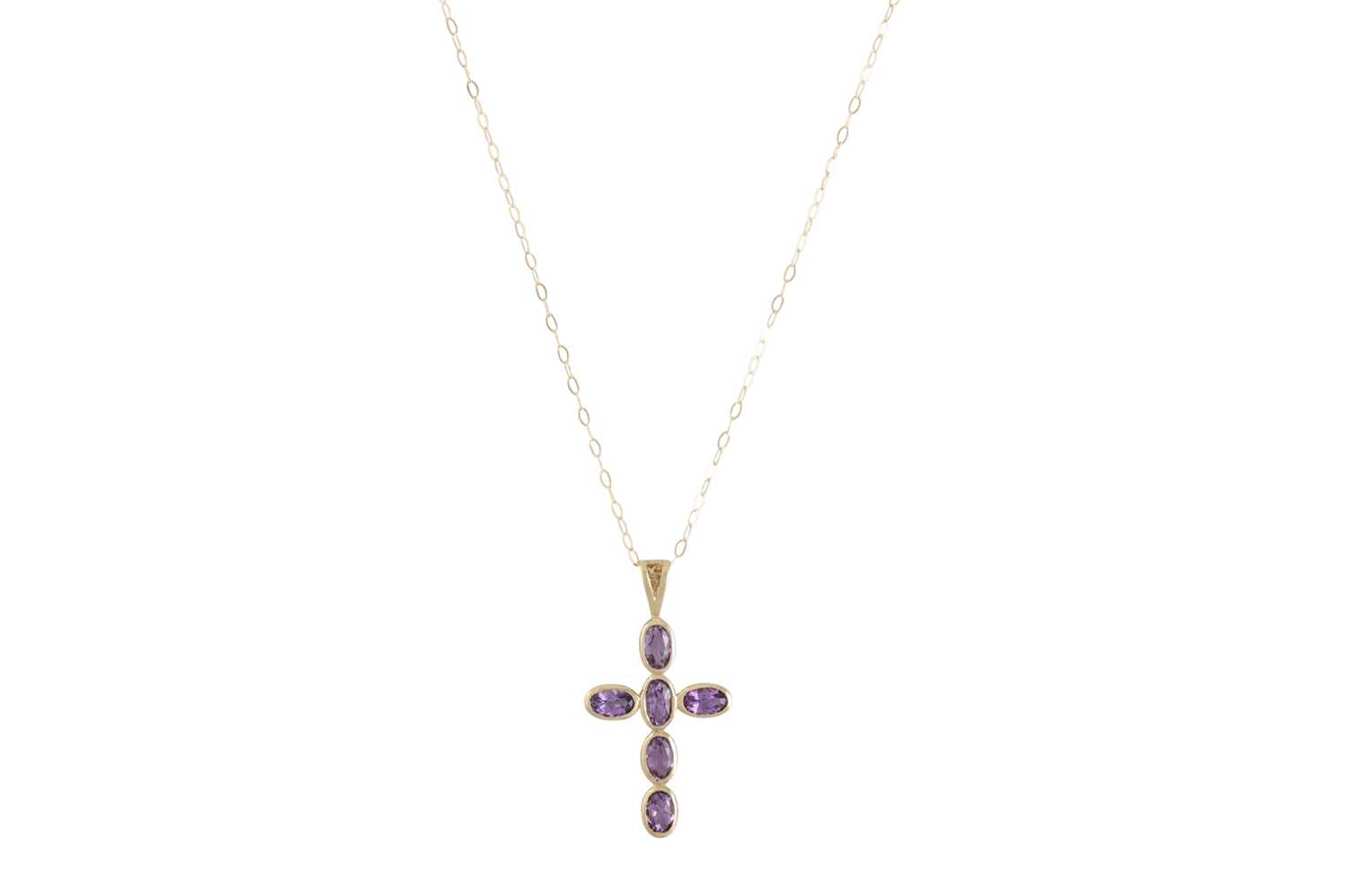 Lot 45 - AN AMETHYST CROSS, mounted in 9ct yellow gold,...