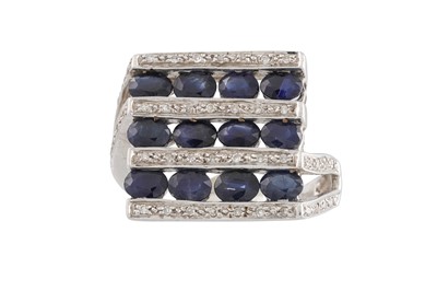 Lot 57 - A DIAMOND AND SAPPHIRE CLUSTER RING, of square...