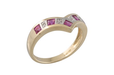 Lot 58 - A RUBY AND DIAMOND RING, v - shaped, mounted...