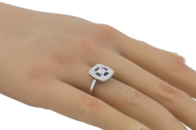 Lot 69 - A DIAMOND AND SAPPHIRE RING, of square plaque...