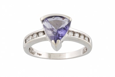 Lot 72 - A DIAMOND AND TANZANITE RING, the pear shaped...