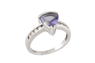 Lot 72 - A DIAMOND AND TANZANITE RING, the pear shaped...