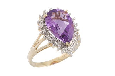 Lot 77 - A DIAMOND AND AMETHYST RING, the pear shaped...