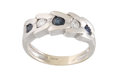 Lot 78 - A DIAMOND AND SAPPHIRE RING, set with three...