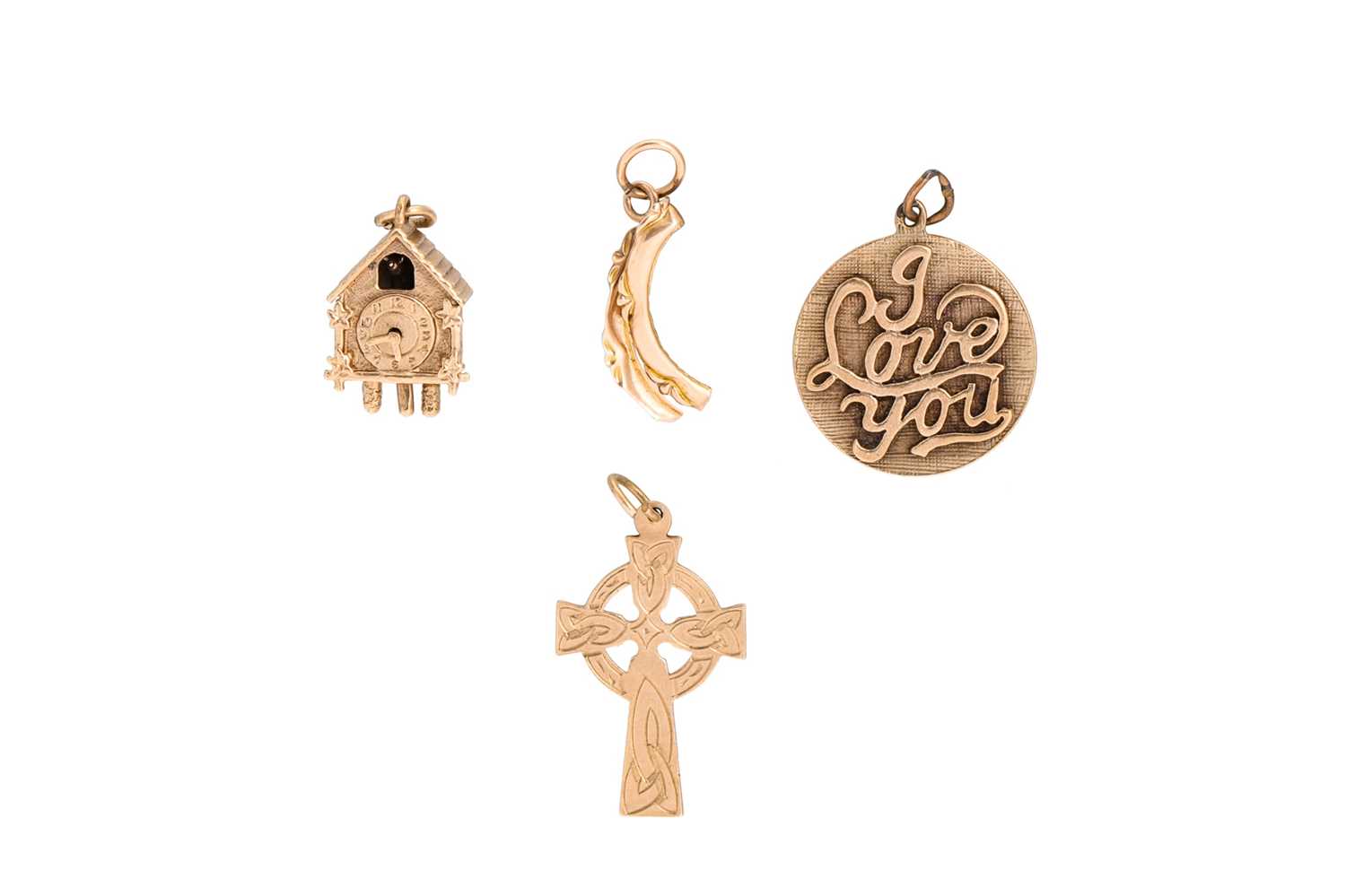 Lot 73 - FOUR 9CT GOLD CHARMS, including one of a...