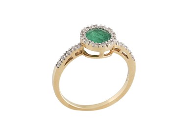 Lot 309 - AN EMERALD AND DIAMOND CLUSTER RING, mounted...