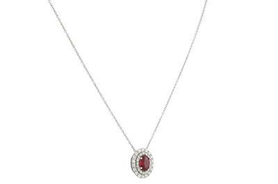 Lot 277 - A RUBY AND DIAMOND CLUSTER PENDANT, the oval...