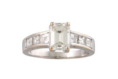 Lot 240 - A DIAMOND SOLITAIRE RING, the emerald cut...