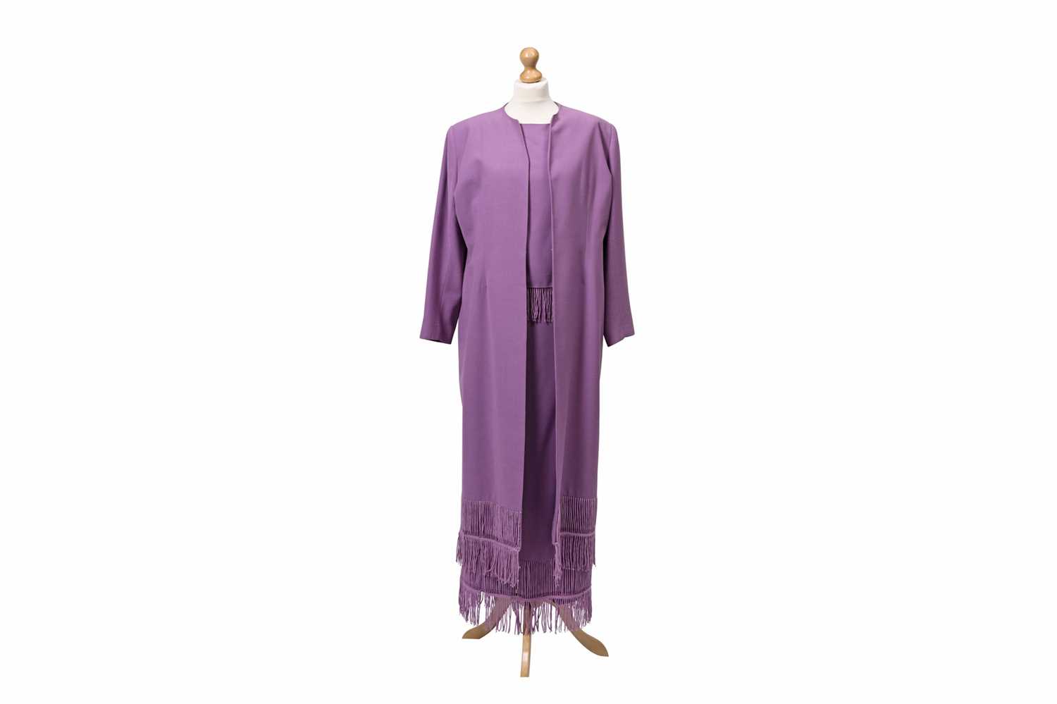 Lot 89 - A LILAC FRINGED CREPE SUIT, comprising of a...