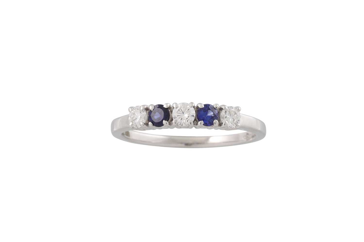 Lot 179 - A DIAMOND AND SAPPHIRE FIVE STONE RING, the...