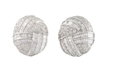 Lot 211 - A PAIR OF DIAMOND EARRINGS, of knot form, set...