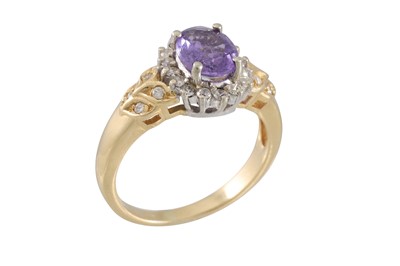 Lot 18 - A DIAMOND AND PURPLE SAPPHIRE CLUSTER RING,...