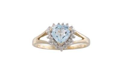 Lot 21 - A DIAMOND AND BLUE TOPAZ CLUSTER RING, mounted...