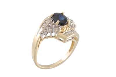 Lot 53 - A DIAMOND AND SAPPHIRE RING, of crossover...