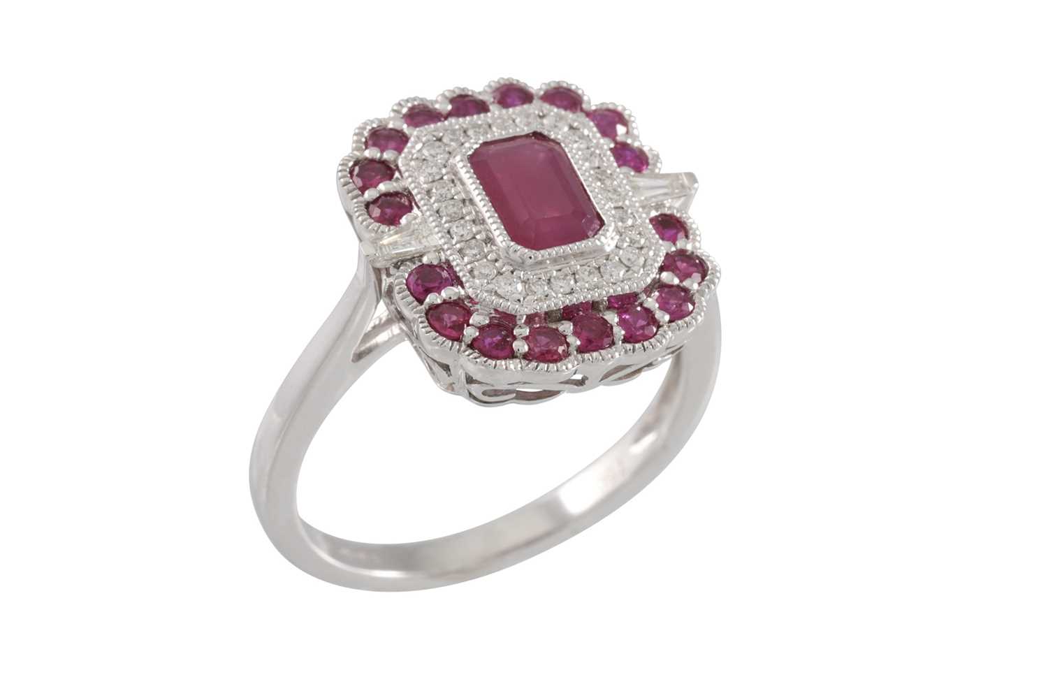 Lot 78 - A DIAMOND AND RUBY CLUSTER RING, of...