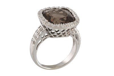 Lot 81 - A SMOKY QUARTZ AND DIAMOND CLUSTER RING, to...