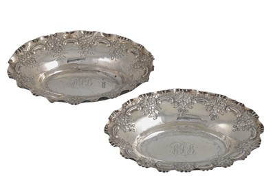 Lot 516 - A PAIR OF VICTORIAN EMBOSSED SILVER BON BON...