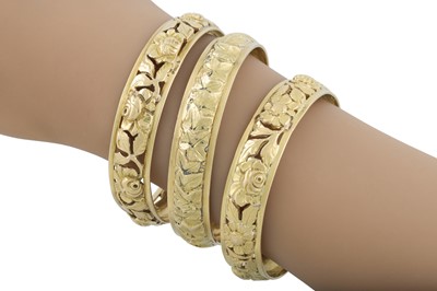 Lot 398 - A SET OF THREE ART NOUVEAU BANGLES, embossed...