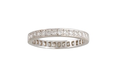 Lot 407 - A DIAMOND ETERNITY RING, the brilliant cut...