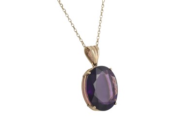 Lot 238 - A LARGE AMETHYST PENDANT OF OVAL FORM, mounted...