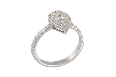 Lot 130 - A DIAMOND CLUSTER RING, the pear shaped panel...