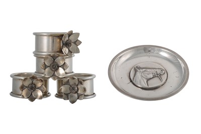 Lot 159 - A SET OF FOUR SILVER PLATED NAPKIN RINGS, by...