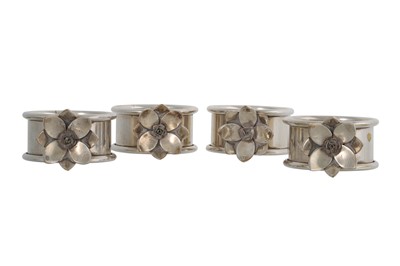 Lot 159 - A SET OF FOUR SILVER PLATED NAPKIN RINGS, by...