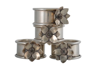 Lot 175 - A SET OF FOUR SILVER PLATED NAPKIN RINGS, by...