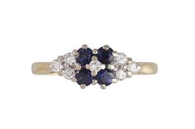 Lot 244 - A DIAMOND AND SAPPHIRE RING, set with four...