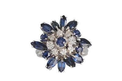 Lot 287 - A SAPPHIRE AND DIAMOND CLUSTER RING, unusual...