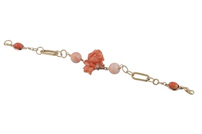 Lot 319 - A CORAL AND GOLD BRACELET, the central rose...