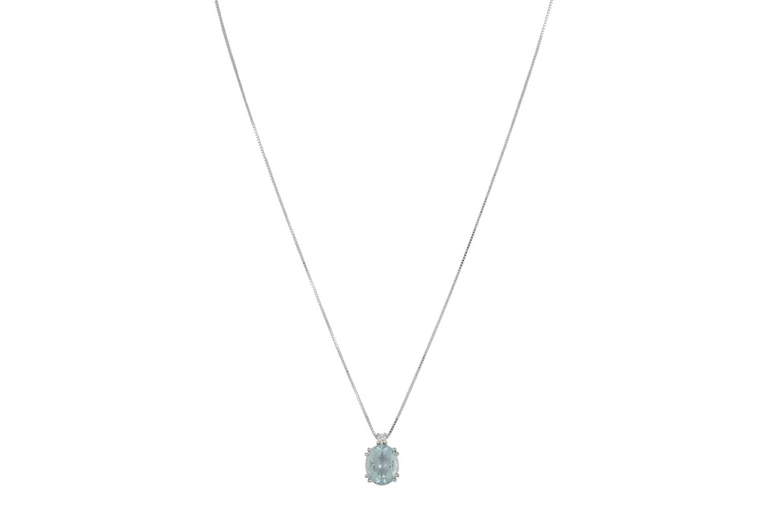 Lot 325 - AN AQUAMARINE AND DIAMOND PENDANT, the oval...