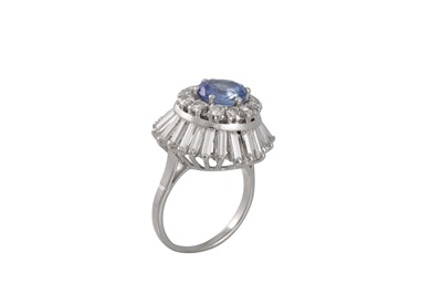 Lot 246 - A DIAMOND AND SAPPHIRE CLUSTER RING, the...