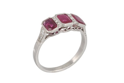 Lot 271 - A THREE STONE RUBY RING, the rubies collet set,...