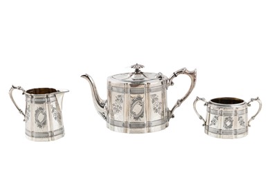 Lot 563 - A THREE PIECE BRITANNIA METAL TEA SET