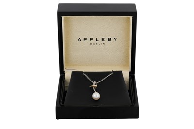 Lot 97 - A CULTURED PEARL AND DIAMOND DROP PENDANT, in...